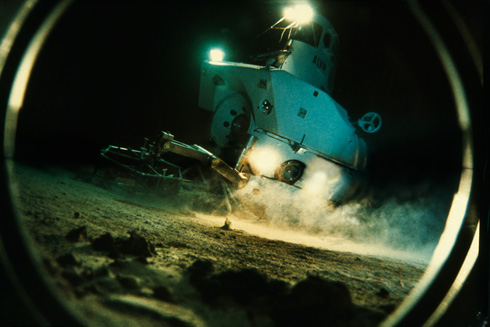 View through a porthole of the submersible Alvin exploring sea floor. (National Geographic/Emory Kristof)