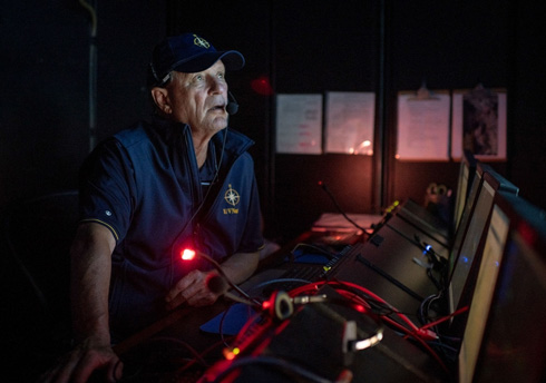 Robert Ballard in control room of the E/V Nautilus while on expedition in the South Pacific. (National Geographic/Gabriel Scarlett)